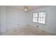 Clean bedroom featuring a ceiling fan and a bright window with a light-colored walls at 160 Pine Grove Dr, Canton, GA 30114