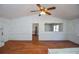 Bright living room featuring hardwood floors, a ceiling fan, and pass through to kitchen at 160 Pine Grove Dr, Canton, GA 30114