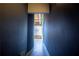 View down a long hallway, showcasing the architecture of the home and an exit to a window view at 204 Walker Sw St # 208, Atlanta, GA 30313