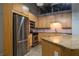 Modern kitchen with granite countertops, stainless appliances, and wood cabinetry at 204 Walker Sw St # 208, Atlanta, GA 30313