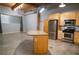 Large kitchen with stainless steel appliances, wood cabinets, and stone countertops at 204 Walker Sw St # 208, Atlanta, GA 30313