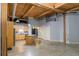 Bright living room featuring wood beams, a kitchen island, and hardwood floors at 204 Walker Sw St # 208, Atlanta, GA 30313
