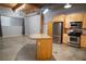 Living room featuring an open floorplan with stainless steel appliances and wood cabinetry at 204 Walker Sw St # 208, Atlanta, GA 30313