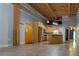 Spacious living room and open kitchen area with exposed beam ceiling at 204 Walker Sw St # 208, Atlanta, GA 30313