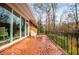 Brick patio with chairs and a wooded view, accessible from sliding glass doors at 2191 Sweetwater Ln, Austell, GA 30106