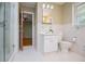 Bathroom featuring a walk-in shower, white vanity, and white tile flooring at 2191 Sweetwater Ln, Austell, GA 30106