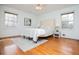 Inviting bedroom featuring hardwood floors, large windows, and neutral decor at 2191 Sweetwater Ln, Austell, GA 30106