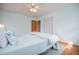 Cozy bedroom featuring hardwood floors, closet, and a modern ceiling fan fixture at 2191 Sweetwater Ln, Austell, GA 30106