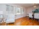 Dining area with hardwood floors, shuttered windows, and stylish lighting fixture at 2191 Sweetwater Ln, Austell, GA 30106