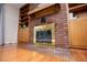 Cozy living room with a brick fireplace, built-in shelves, and hardwood floors at 2191 Sweetwater Ln, Austell, GA 30106