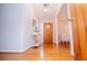 Inviting foyer with gleaming hardwood floors and a charming entry table and vase at 2191 Sweetwater Ln, Austell, GA 30106