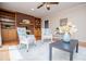 Inviting living room with hardwood floors, built-in shelving, a brick fireplace, and ample seating at 2191 Sweetwater Ln, Austell, GA 30106