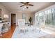 Bright living room with hardwood flooring, large windows and sliding doors to the backyard at 2191 Sweetwater Ln, Austell, GA 30106