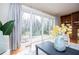 View of the patio through sliding glass doors of a living room with hardwood floors and traditional décor at 2191 Sweetwater Ln, Austell, GA 30106