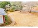 A large yard with bare trees and a stone pathway leading to the building at 2191 Sweetwater Ln, Austell, GA 30106