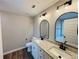 Bathroom featuring dual sinks, granite countertops, and modern fixtures at 494 West Ave, Bowdon, GA 30108