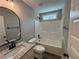 Well-lit bathroom showcases a granite vanity, sleek fixtures, and a tub-shower combination at 494 West Ave, Bowdon, GA 30108