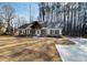 Charming home featuring a covered porch with timber accents and a concrete driveway at 494 West Ave, Bowdon, GA 30108