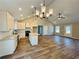 Well-lit open-concept kitchen with a large island, stainless appliances, and modern finishes at 494 West Ave, Bowdon, GA 30108