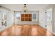 Bedroom with hardwood flooring, natural light, and paneled artwork at 5692 Rock Patch Rd, Loganville, GA 30052