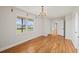 Bedroom with hardwood floors, a window view and neutral paint at 5692 Rock Patch Rd, Loganville, GA 30052