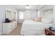 Bright bedroom with carpet, dressers and a large mirrored wall creating an inviting space at 2426 Westland Way, Acworth, GA 30102