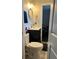 Bathroom featuring a stylish black vanity, gold hardware and a toilet at 4025 Gretna Green Dr, Decatur, GA 30035