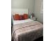 Cozy bedroom featuring a comfortable bed with decorative pillows and a side table at 4025 Gretna Green Dr, Decatur, GA 30035