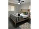 Bedroom features a comfortable queen size bed, stylish light fixtures and a modern rug at 4025 Gretna Green Dr, Decatur, GA 30035