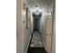 Hallway with decorative rug and overhead lighting, features neutral paint and trim at 4025 Gretna Green Dr, Decatur, GA 30035