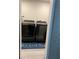 Modern laundry room featuring new black stainless steel washer and dryer at 4025 Gretna Green Dr, Decatur, GA 30035
