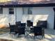 A charming brick patio with string lights overhead and stylish patio furniture, perfect for outdoor entertaining and relaxation at 4025 Gretna Green Dr, Decatur, GA 30035