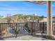 Enjoy city views from this condo balcony, featuring a black iron railing and a concrete pillar in a natural light setting at 200 River Vista Dr # 608, Atlanta, GA 30339