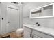 This well-lit bathroom features a white vanity and an LED mirror at 200 River Vista Dr # 608, Atlanta, GA 30339