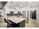 Modern kitchen with white cabinets, stainless steel appliances, and a large center island with bar stool seating at 200 River Vista Dr # 608, Atlanta, GA 30339