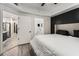Spacious main bedroom with ensuite bathroom access and a glimpse of a well-equipped kitchen at 200 River Vista Dr # 608, Atlanta, GA 30339