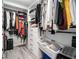 A walk-in closet featuring built-in shelving and hanging racks provides ample storage at 200 River Vista Dr # 608, Atlanta, GA 30339