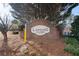 Community entrance sign with brick architecture and lush landscaping at 2956 Stanstead Cir, Norcross, GA 30071