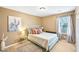Cozy bedroom with comfortable-looking bed, neutral walls, and natural light from the window at 7595 Waverly Loop, Fairburn, GA 30213