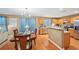 Bright dining area next to the kitchen, showcasing a wooden table and views of the living spaces at 7595 Waverly Loop, Fairburn, GA 30213