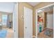 Hallway with view to a laundry room and a small living area at 7595 Waverly Loop, Fairburn, GA 30213