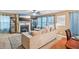 Inviting living room with a fireplace, elegant decor, and a smooth transition into the dining area at 7595 Waverly Loop, Fairburn, GA 30213