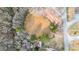 Aerial view of a home nestled next to a pond, showcasing its natural surroundings at 257 Crossroads Church Rd, Rockmart, GA 30153