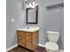 Functional bathroom with a single sink vanity and standard toilet and fixtures at 257 Crossroads Church Rd, Rockmart, GA 30153