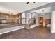 Open living room and kitchen layout with wood floors and stairs at 257 Crossroads Church Rd, Rockmart, GA 30153