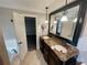 This bathroom features double sinks, marble countertop, and a large tub at 215 Buck Run, Loganville, GA 30052