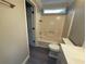 This bathroom features a single vanity, shower, and toilet at 215 Buck Run, Loganville, GA 30052