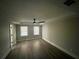 This bedroom features hardwood floors, crown molding, and a ceiling fan at 215 Buck Run, Loganville, GA 30052