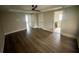 This bedroom features hardwood floors with a bathroom and walk-in closet at 215 Buck Run, Loganville, GA 30052
