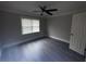 This bedroom features gray hardwood floors, and a door at 215 Buck Run, Loganville, GA 30052
